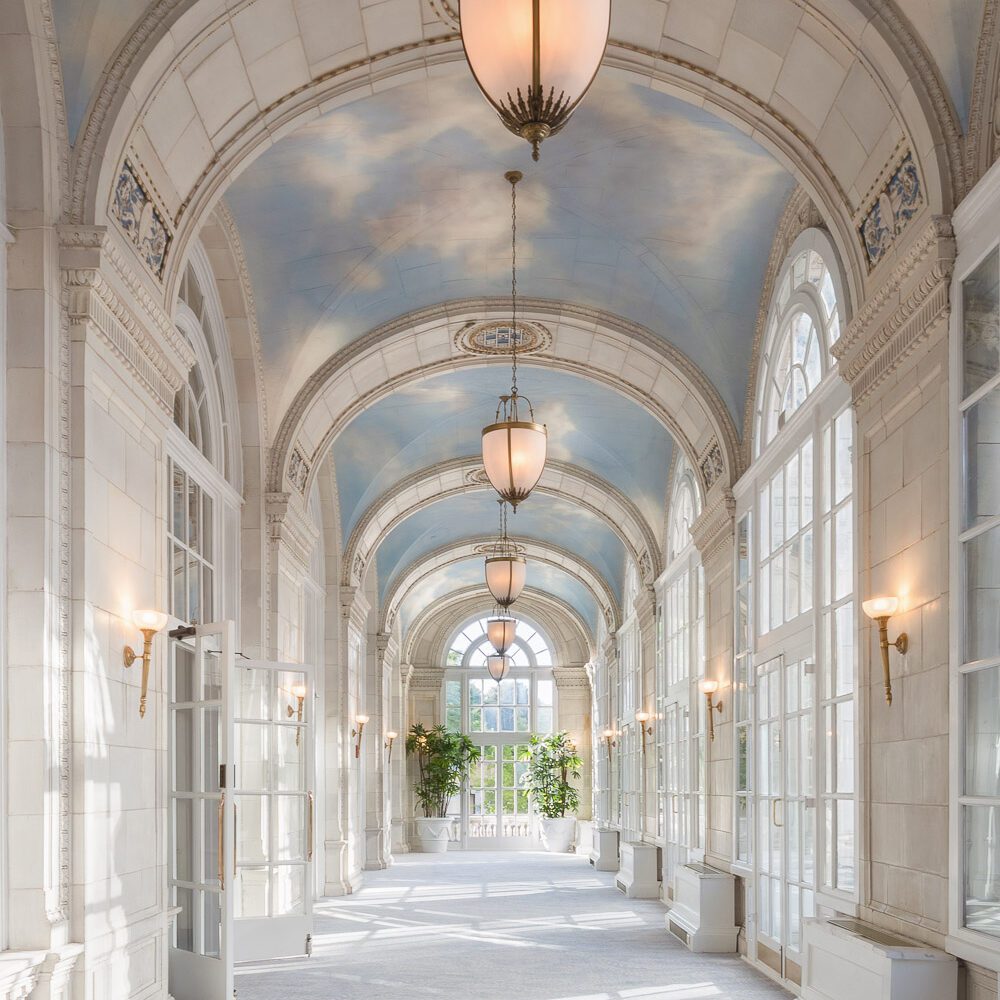 High arched ceilings with painted blue sky and white clouds with large floor to ceiling windows at our Nashville, TN hotel.